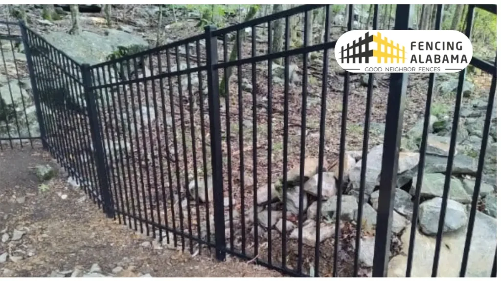 Racked cedar privacy fence following a sloped back yard in Huntsville, Alabama, with rails angled to the grade and pickets vertical